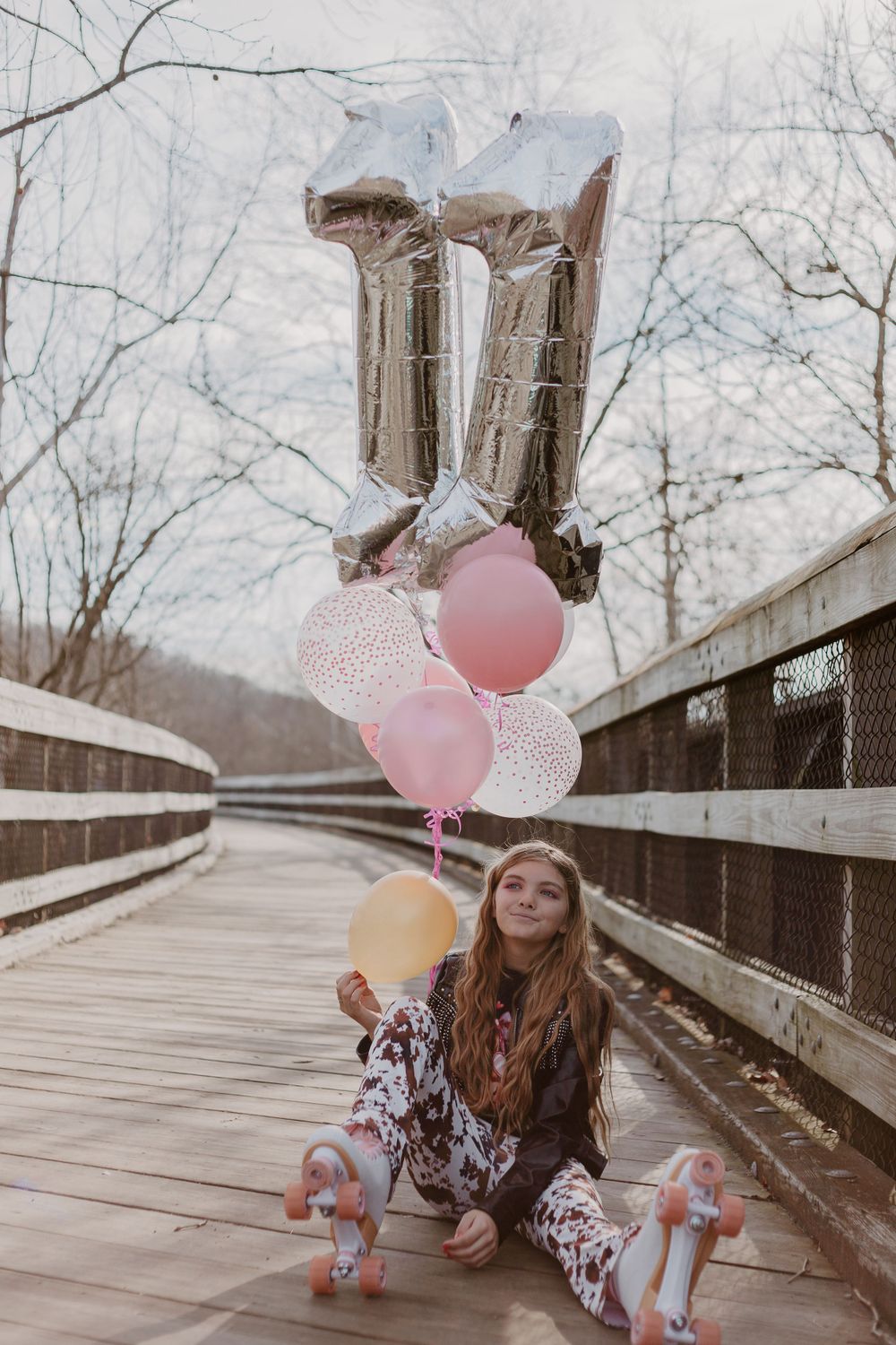 Teen girl with balloons at birthday session in Downtown Lynchburg VA