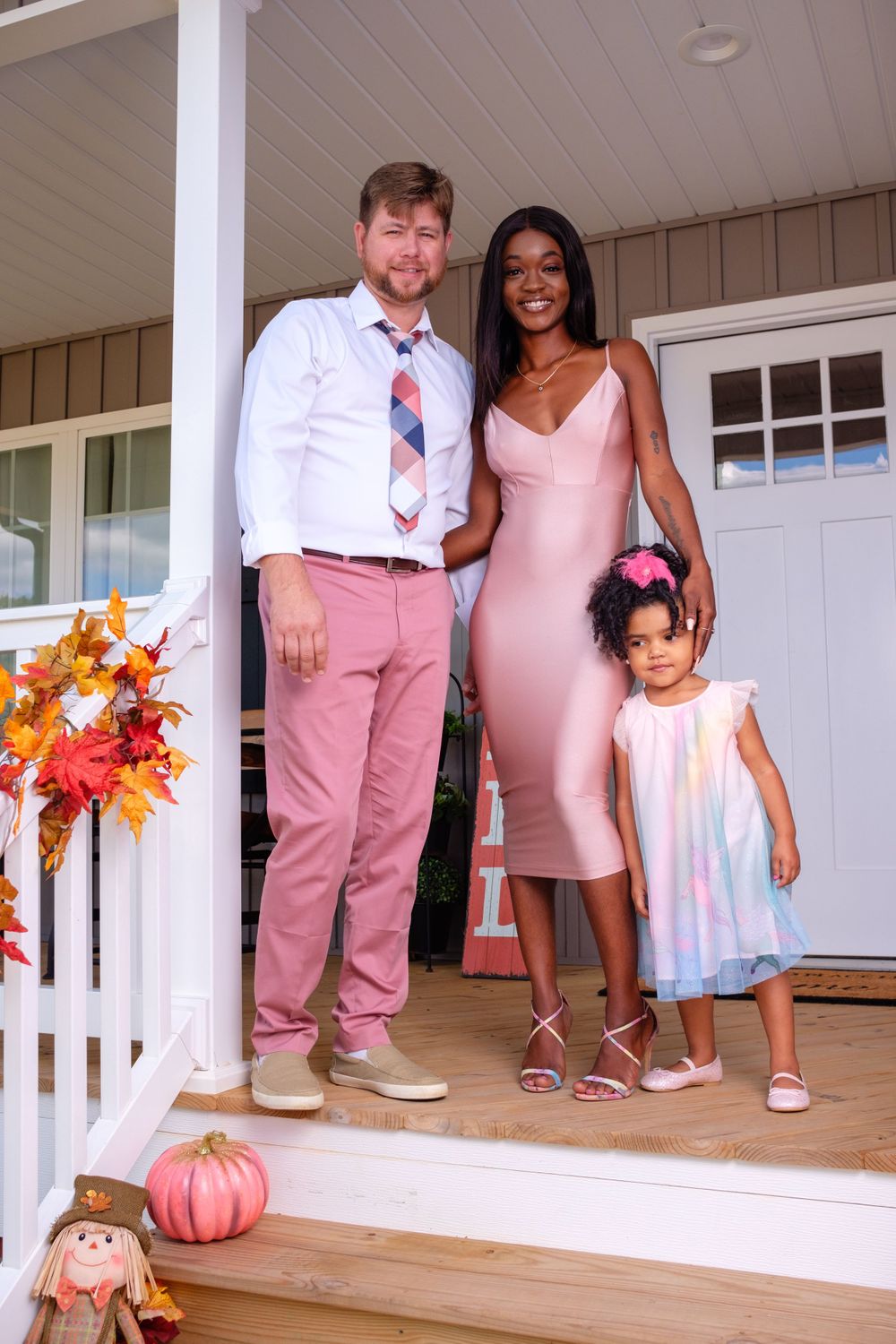 Family Photography: Beautiful family photo of 3 standing on a front porch