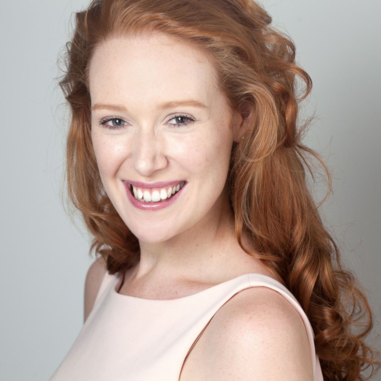 Actor female headshot smiling direct to camera. Perth Headshots.