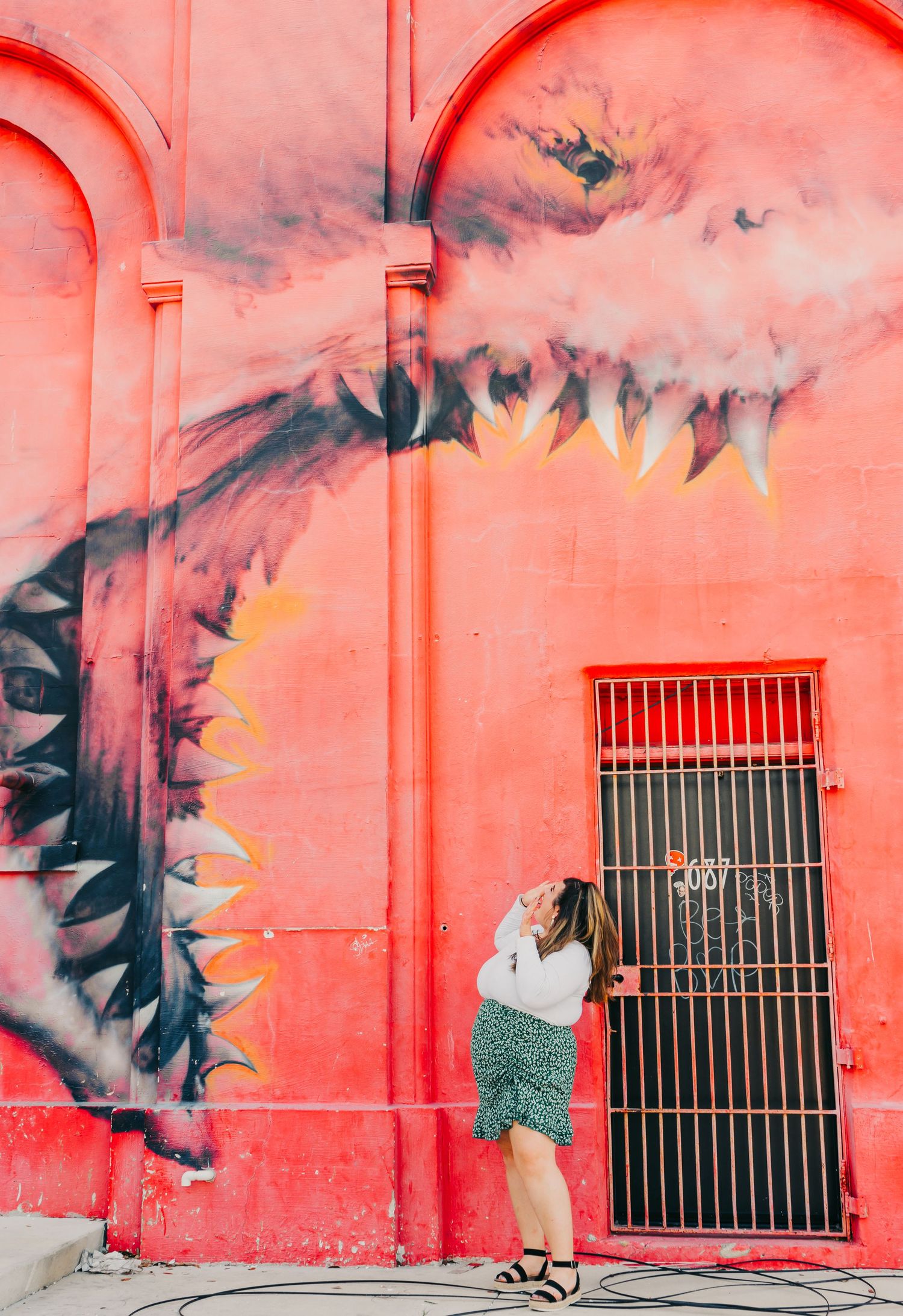 Outdoor Headshot Session in St. Pete, FL; Woman posing with shark mural