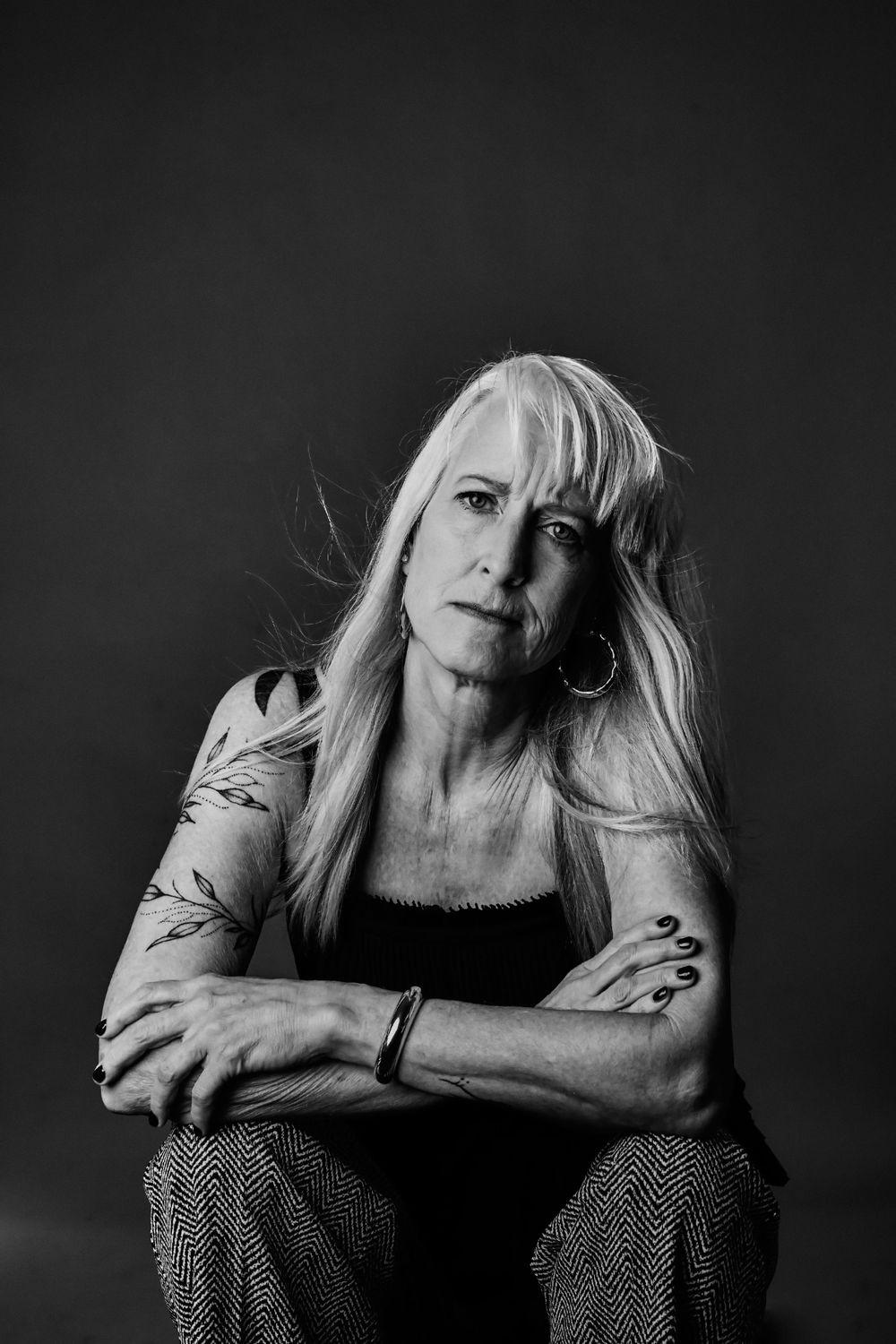 Intimate black and white portraits featuring polka dot dress and expressive poses.