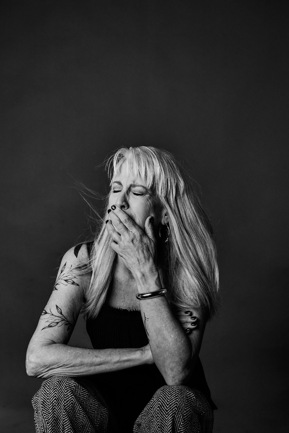 Dramatic portrait series showing vulnerability and self-expression in black and white.