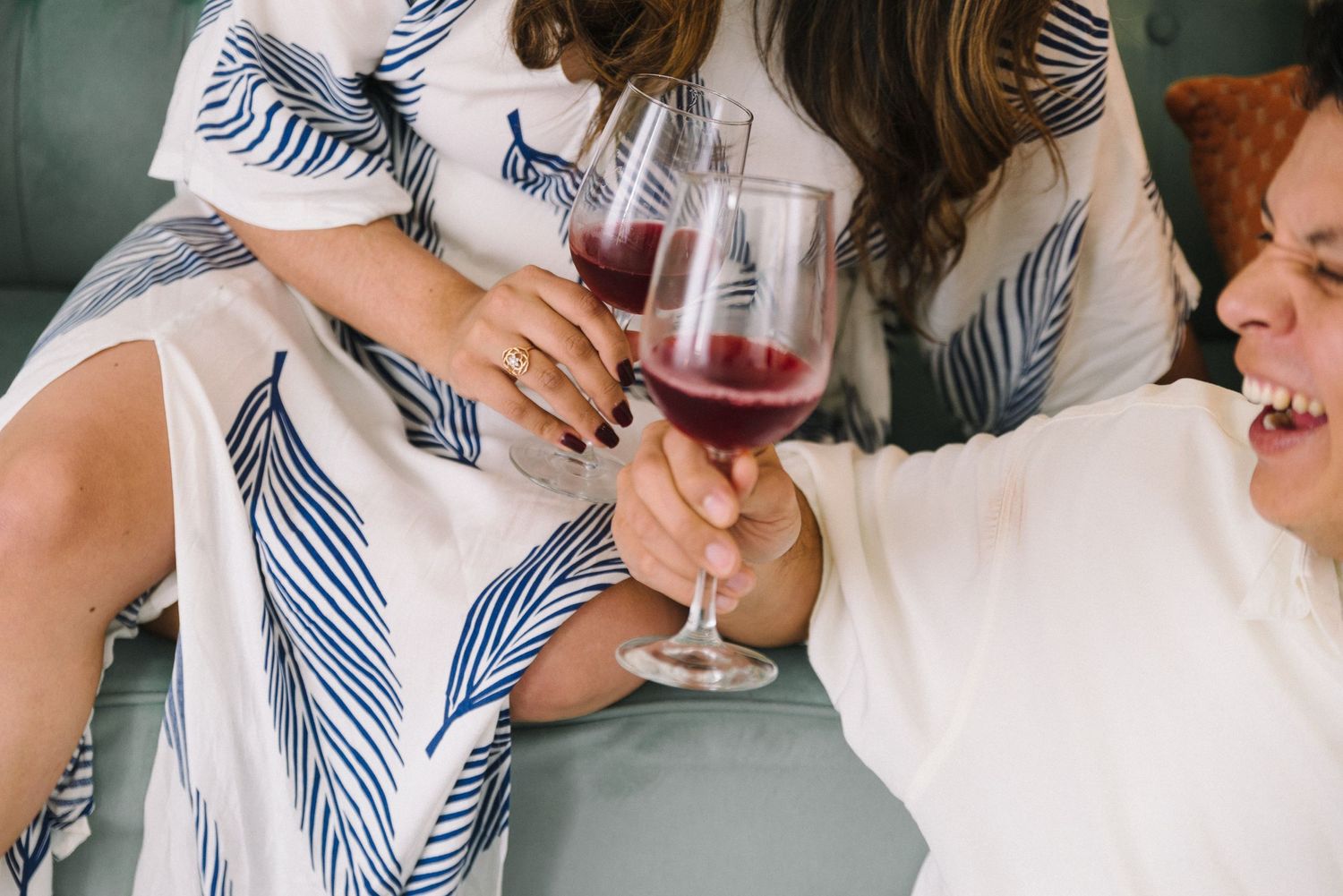 Engagement picture of couple tasting wine.