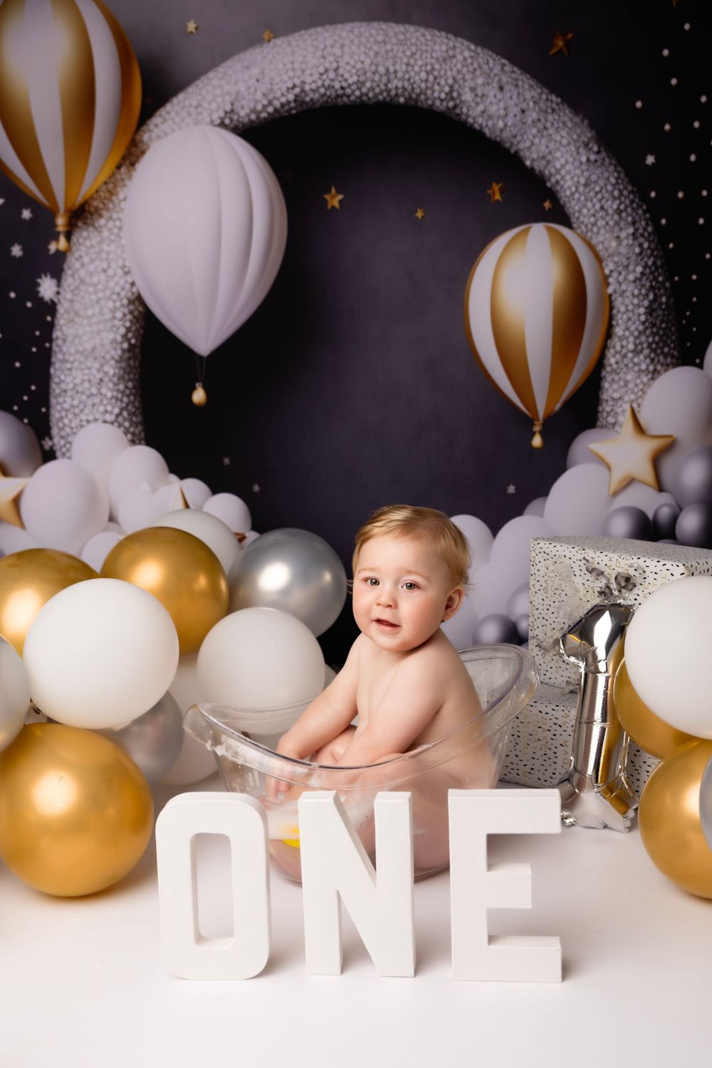 boy's first birthday splash session photo
