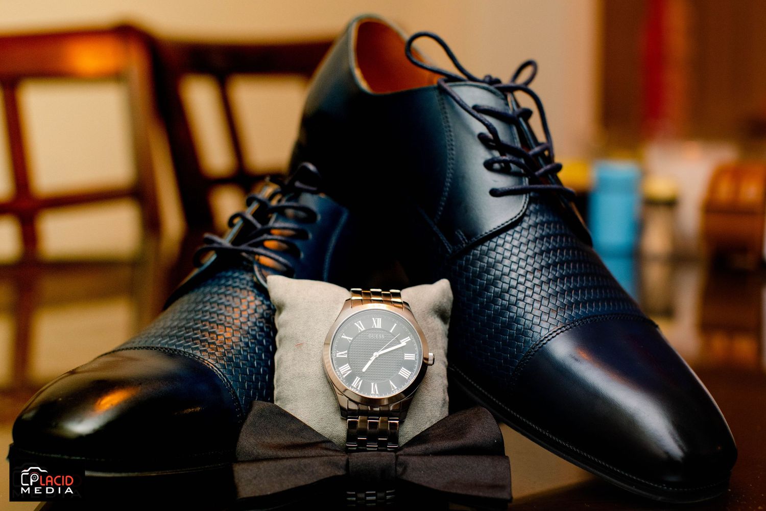 Groom shoe details with watch photograph
