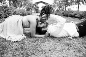 couple at cox arboretum laying down posing