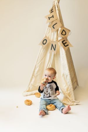 first birthday cake smash with donuts and cute boy