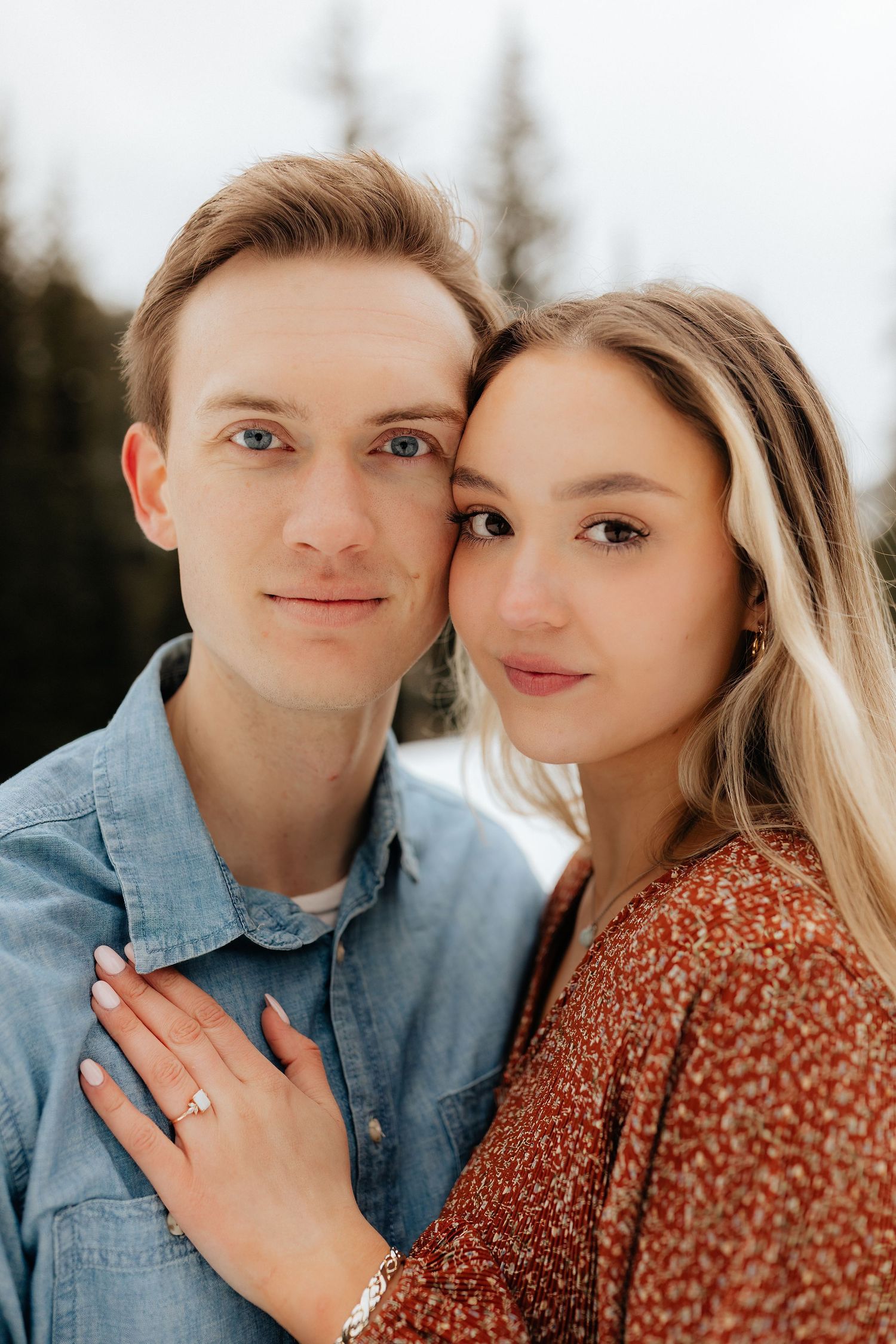 Couple with temples together looking straight at camera