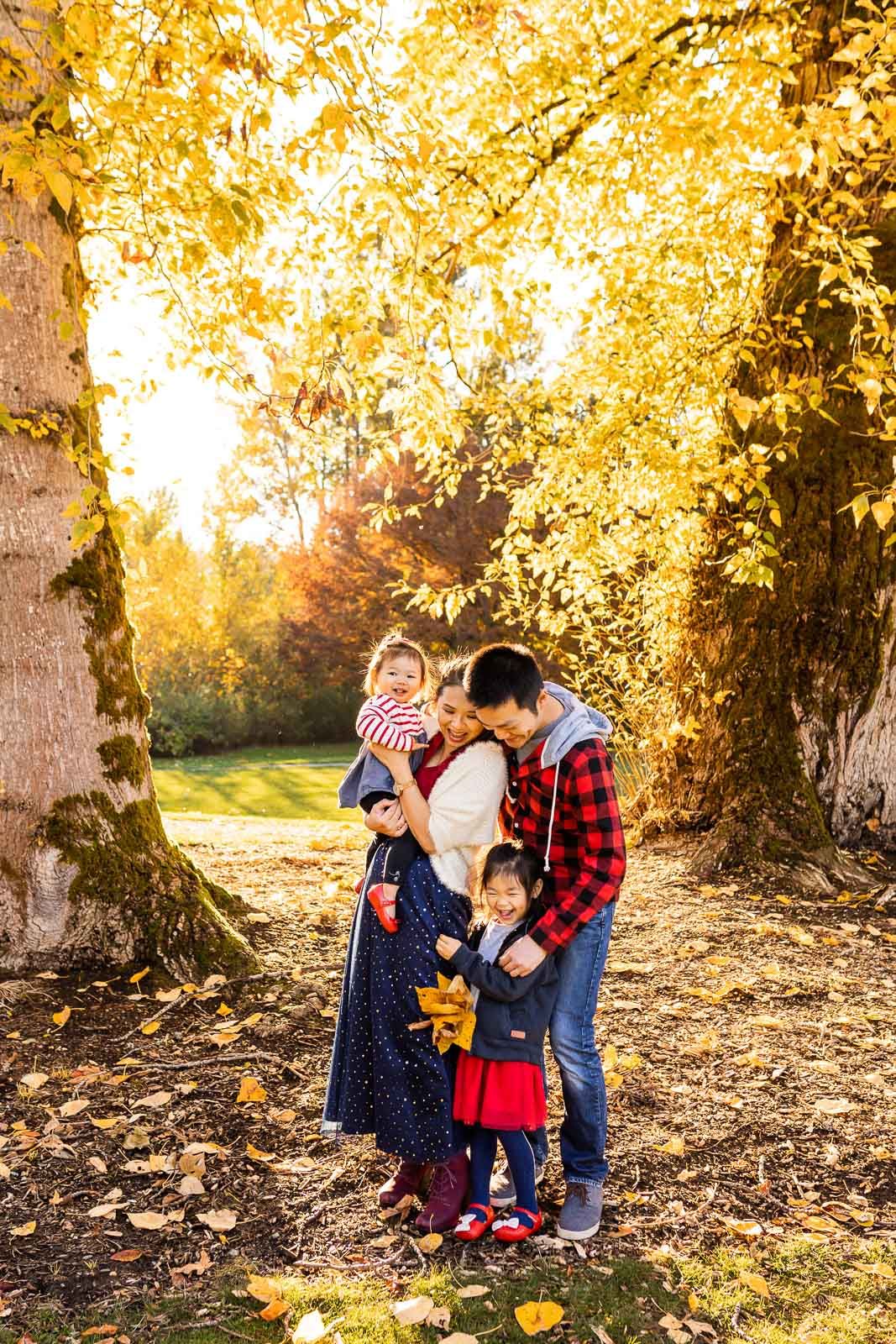 A family hugging each other at confluence park in Issaquah
