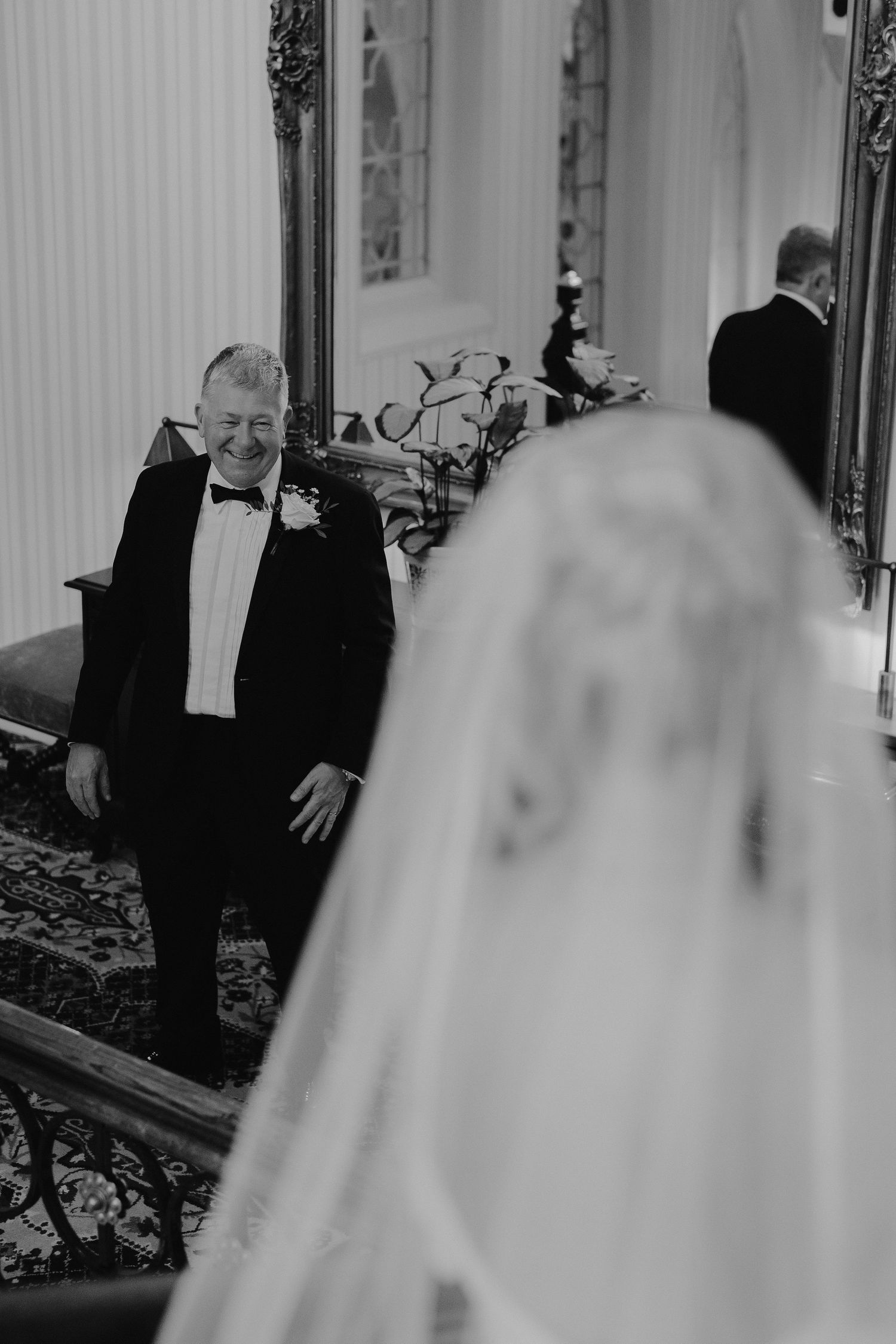 father of bride seeing bride for the first time in her wedding dress at the Randolph hotel in Oxford