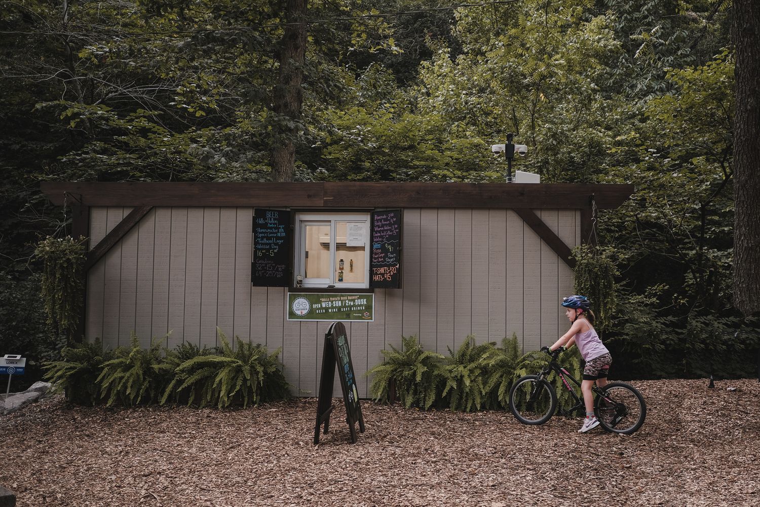 Girl on bike at the Gear Garden in Blowing Springs in Bella, Vista, Arkansas for portrait lifestyle photography.