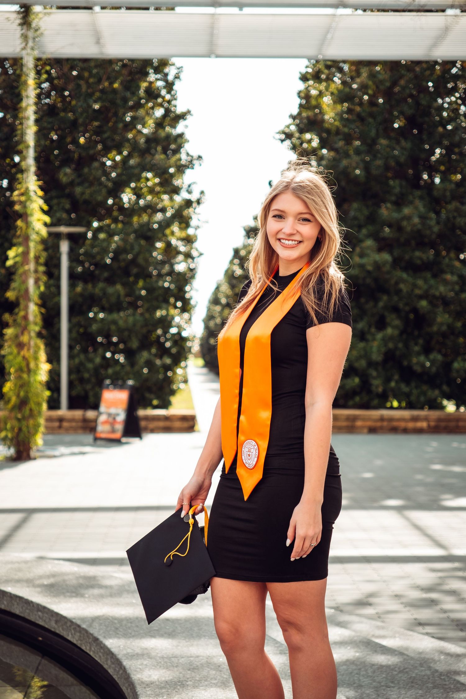 Portrait of a UTD Graduate taken by Eric Aaberg Photography, at UT Dallas Campus.