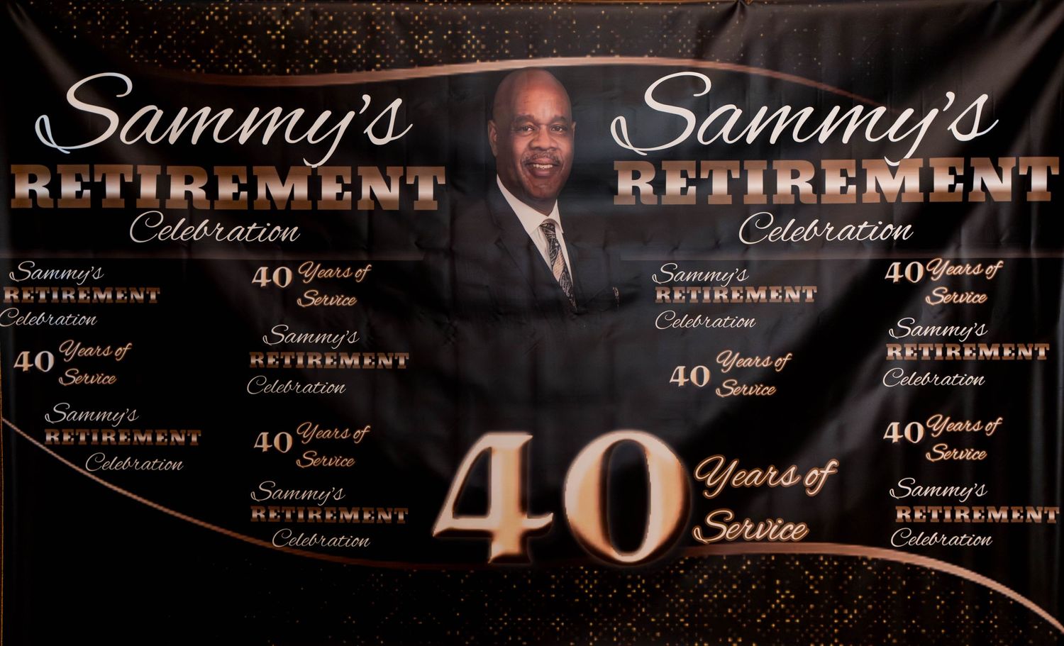 40th retirement celebration banner with gold text on black background.