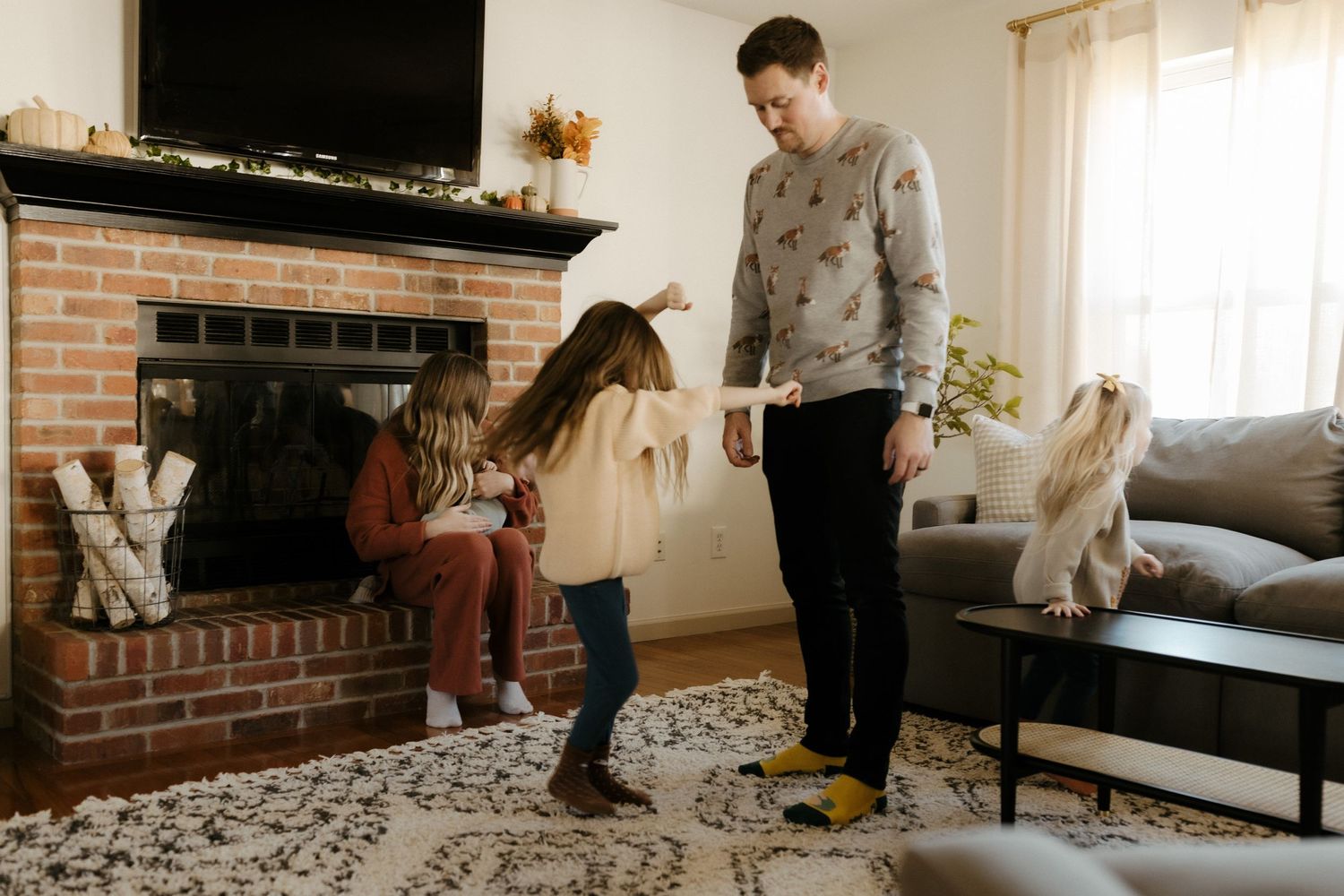 Candid family portrait in Joplin, Missouri captured in natural light by Modern Moods Imagery, showing genuine connection and movement.