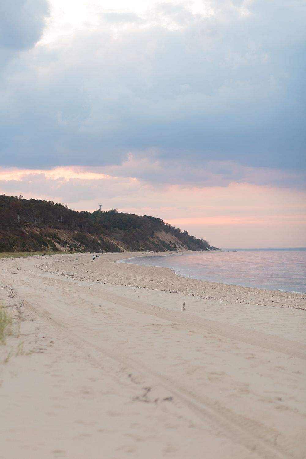 a pastel sunset in pink and blue hues at the beach in Long Island photographed by Paula Ortiz NY Family Photographer