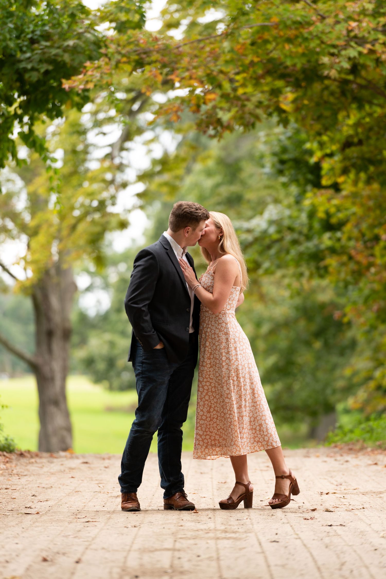 Couple kiss engagement portraits at Red Apple Farm in Ipswich on Boston's North Shore with Leah Ramuglia Photography