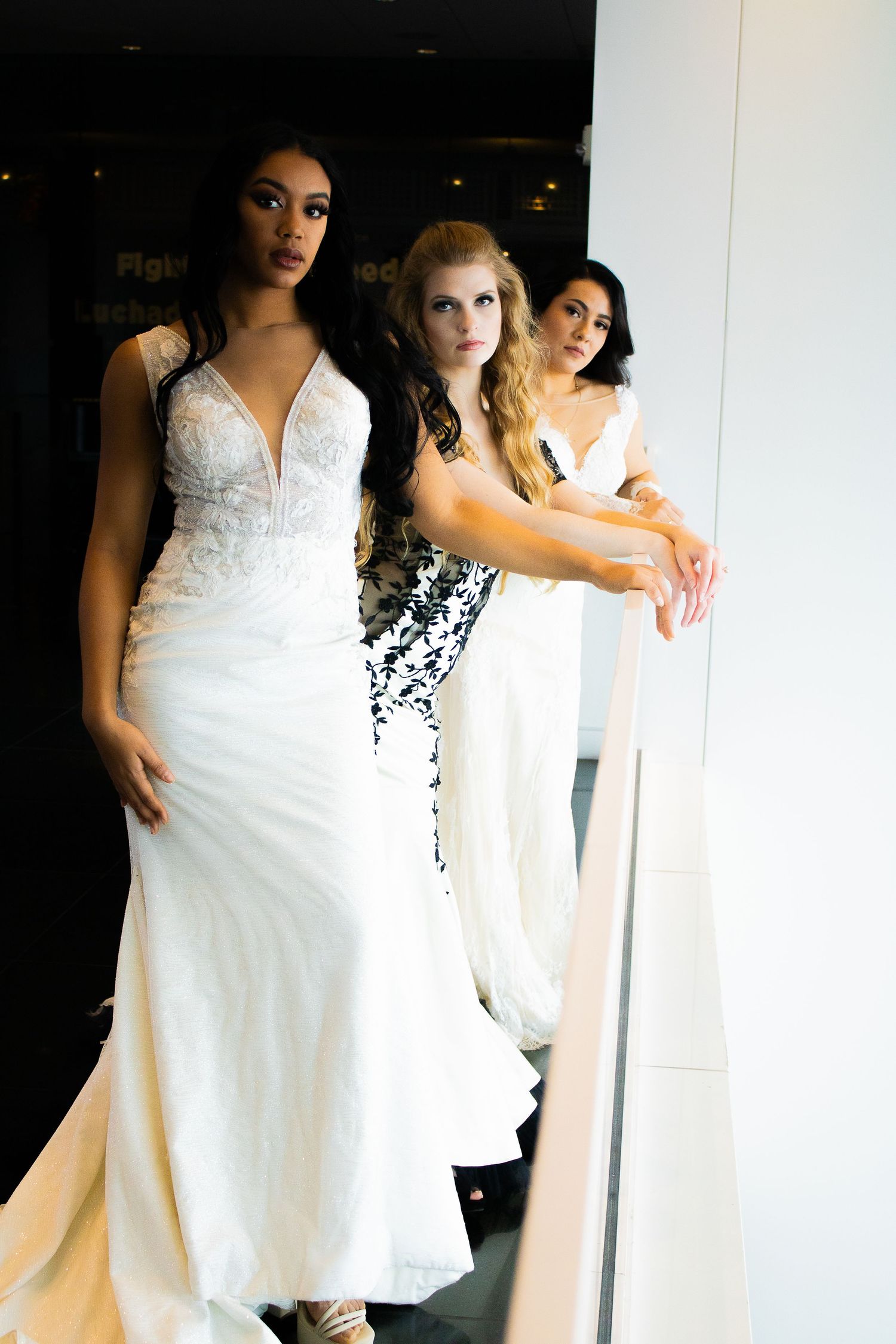Group photo series in white dresses against bright studio backdrop.