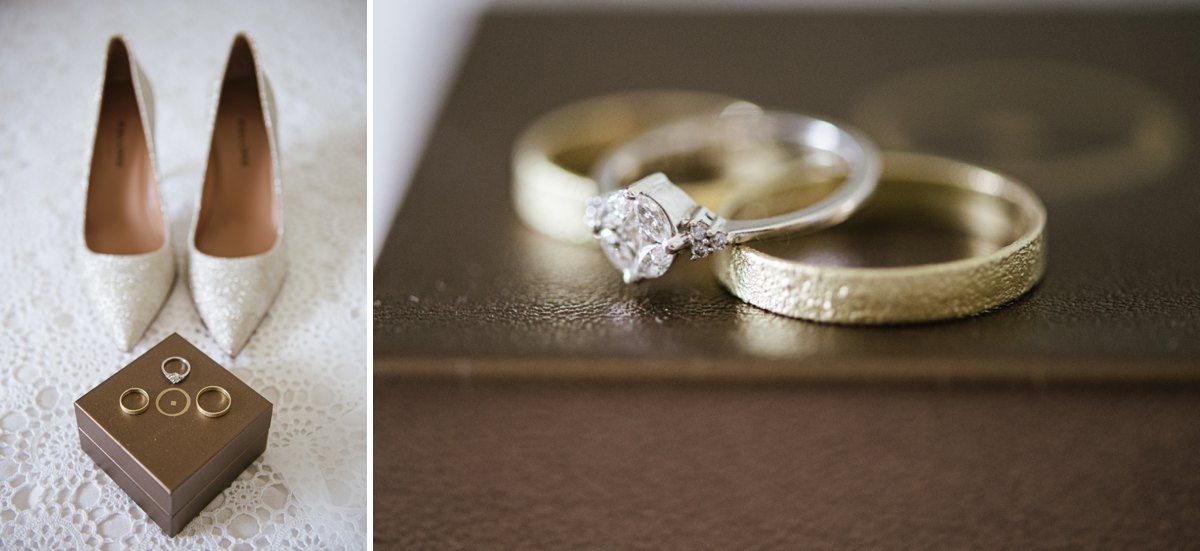 Wedding rings and bridal shoes arranged on brown surface for detail shot.