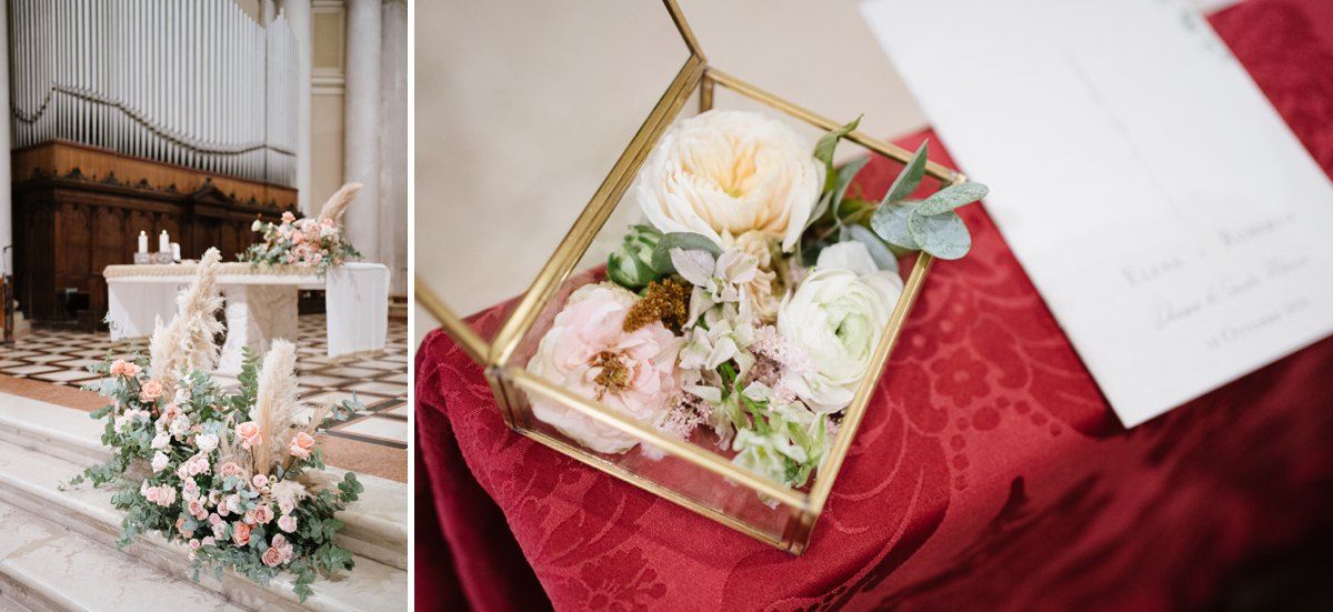Wedding decorations and gift boxes displayed with pink flowers and candles.