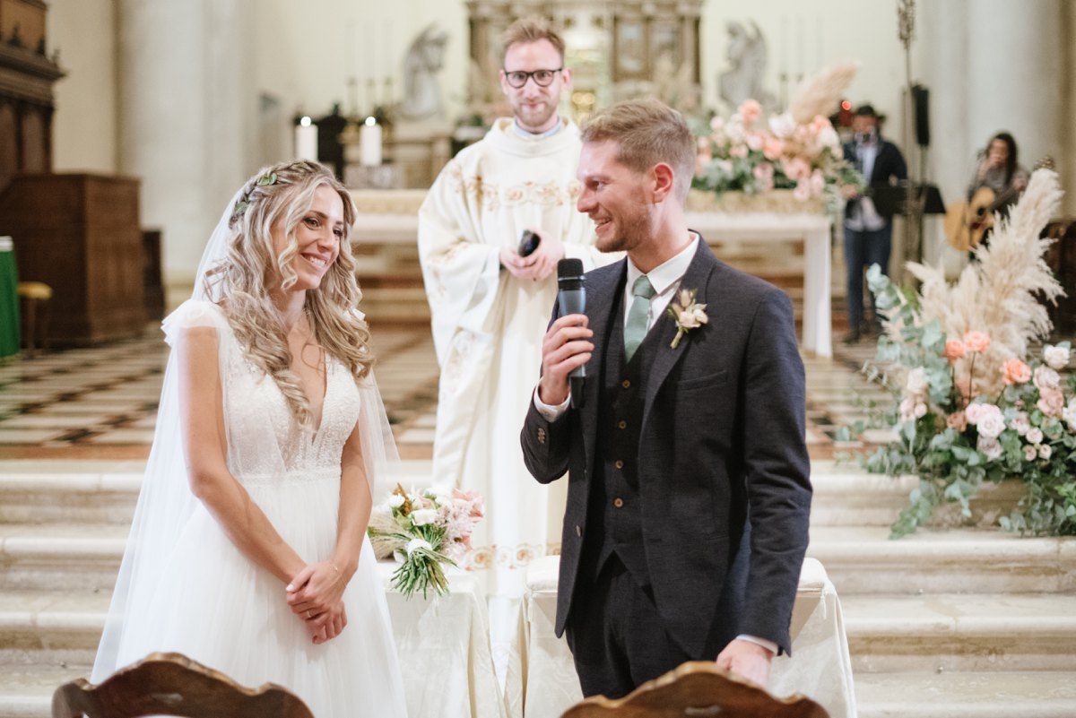 Couple shares a tender moment at the altar during their church wedding ceremony.