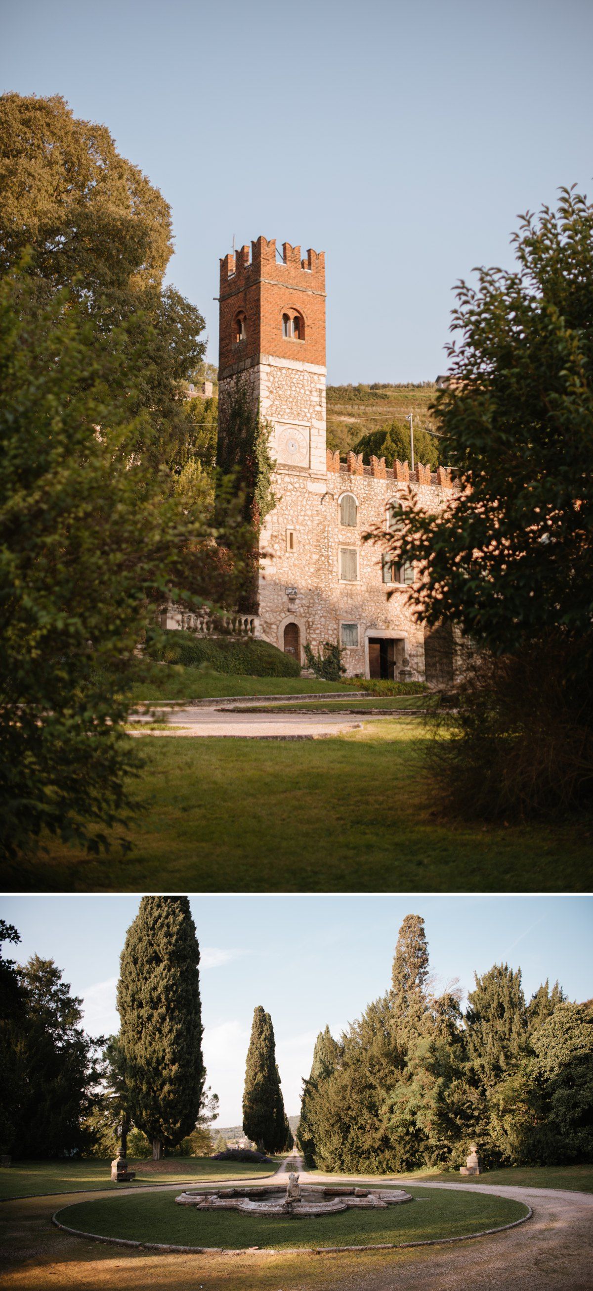 Medieval stone castle tower and fountain garden set against clear blue sky.