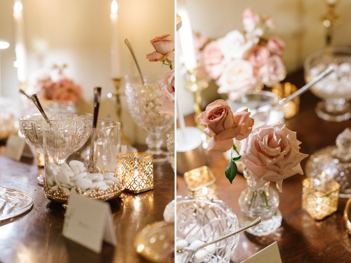 Vintage crystal glassware and pink roses create romantic wedding table decor.