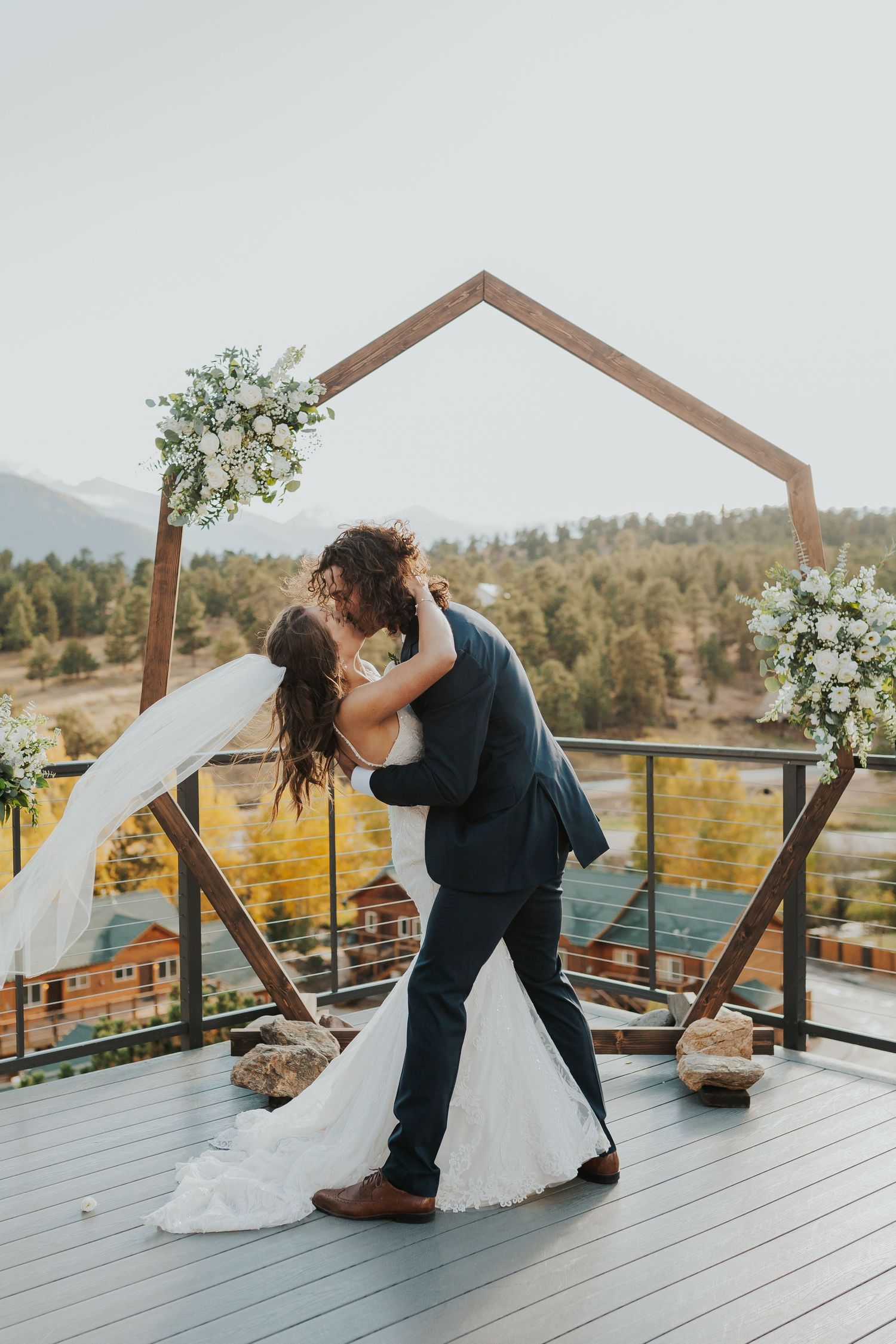 Bride and groom first kiss in Estes Park, Colorado