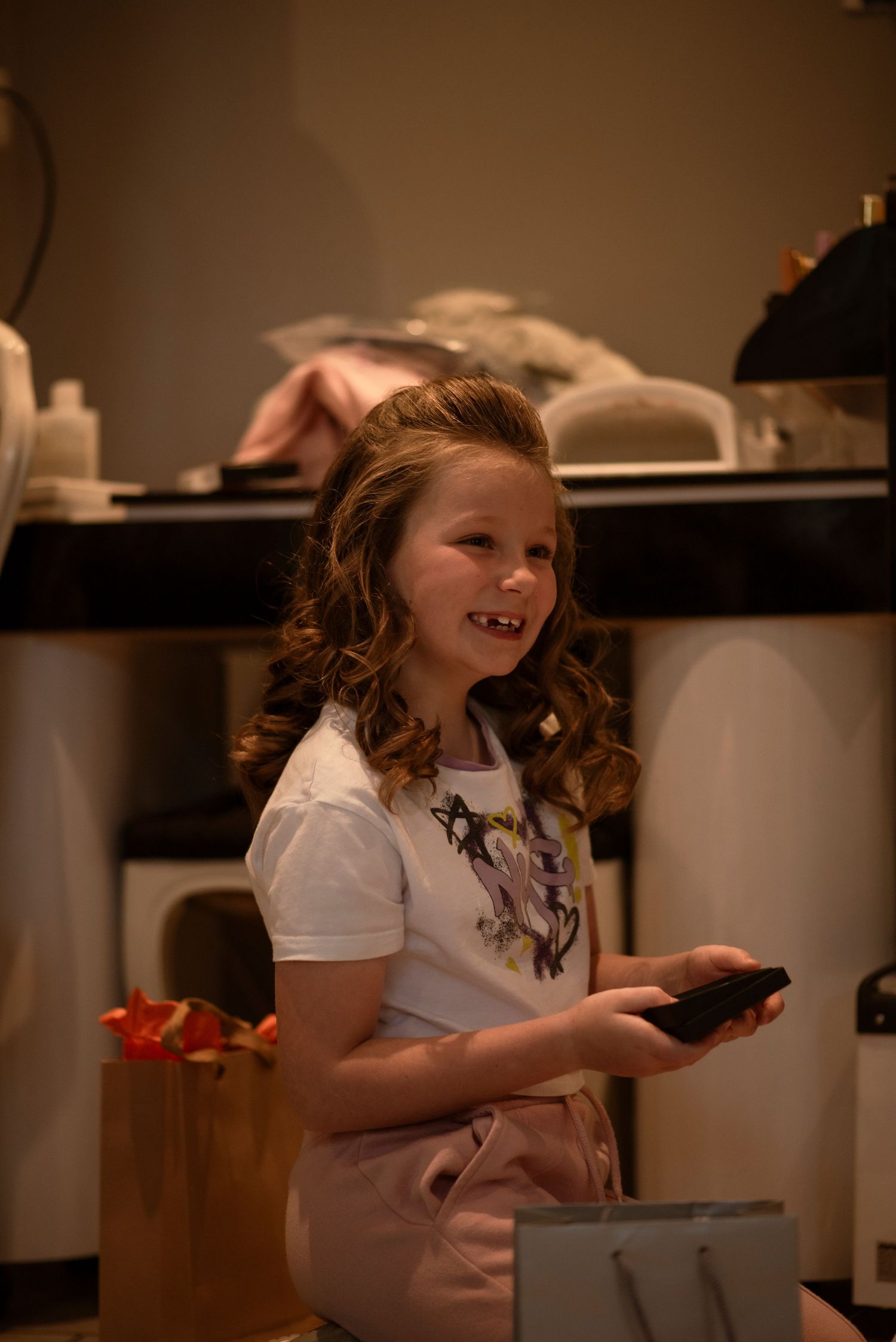 happy flower girl receiving a gift, sheffield wedding