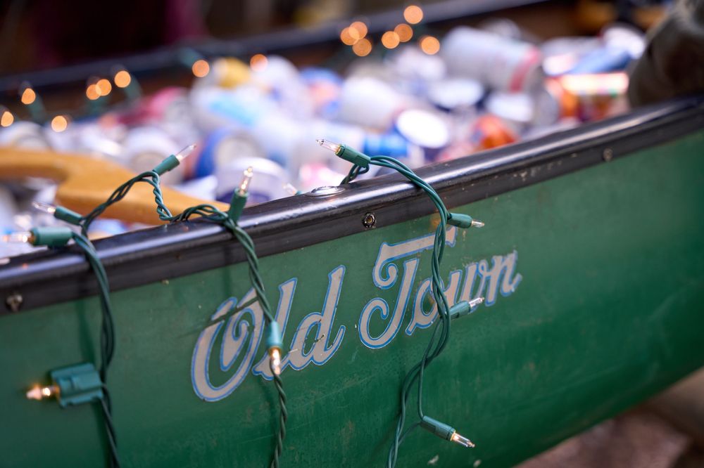 "Old Town" canoe holds sprightly assortment of beverages for wedding guests