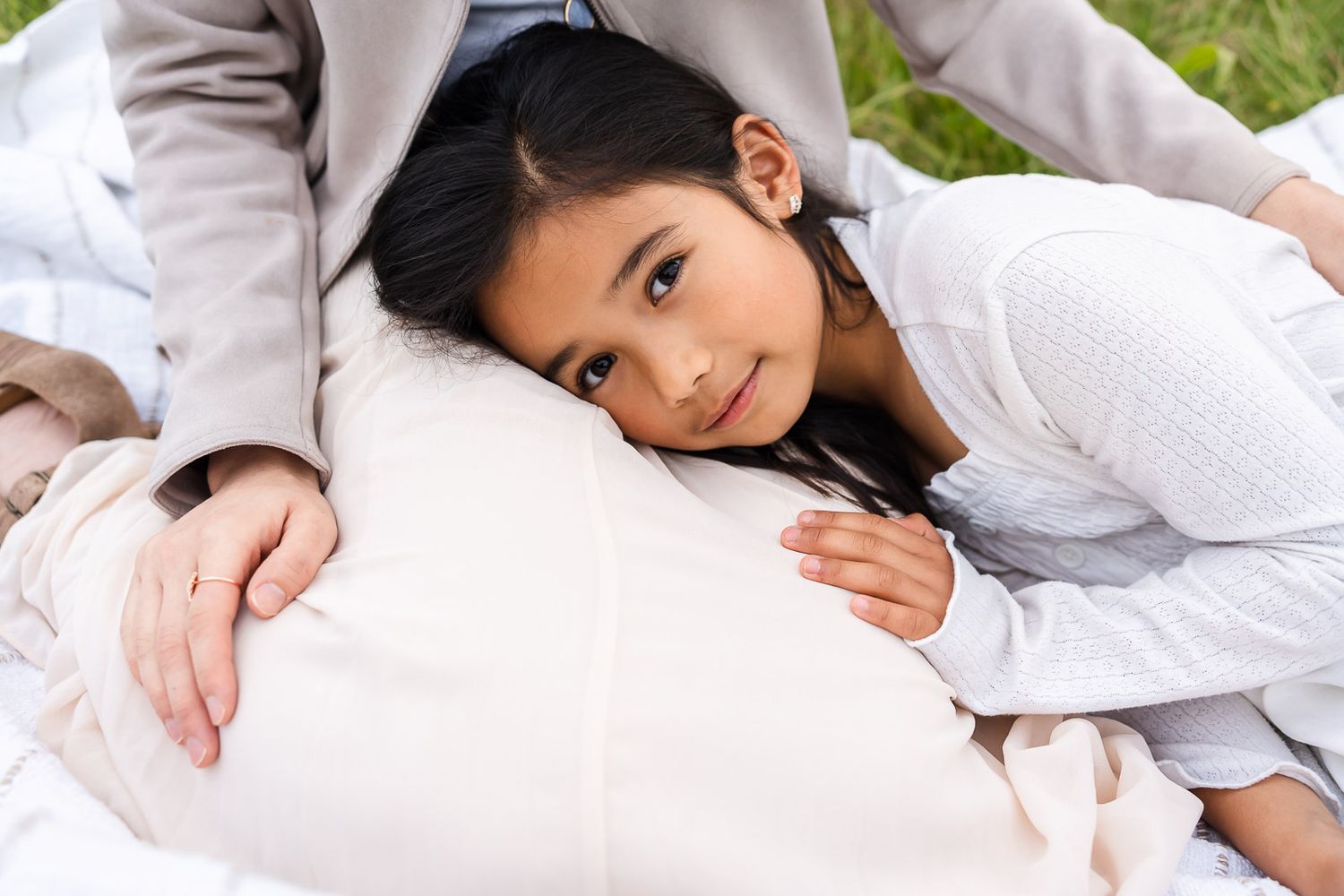 Daughter resting on mother's lap in Kirkland