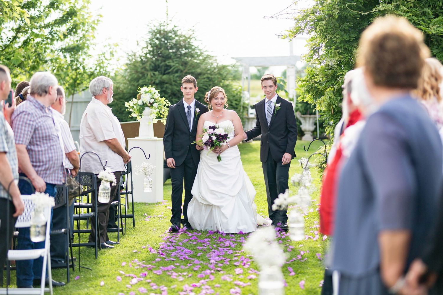 Sarai Minard Photography photo of Bride walking down the aisle at the Ritzy Ranch in Bolivar MO