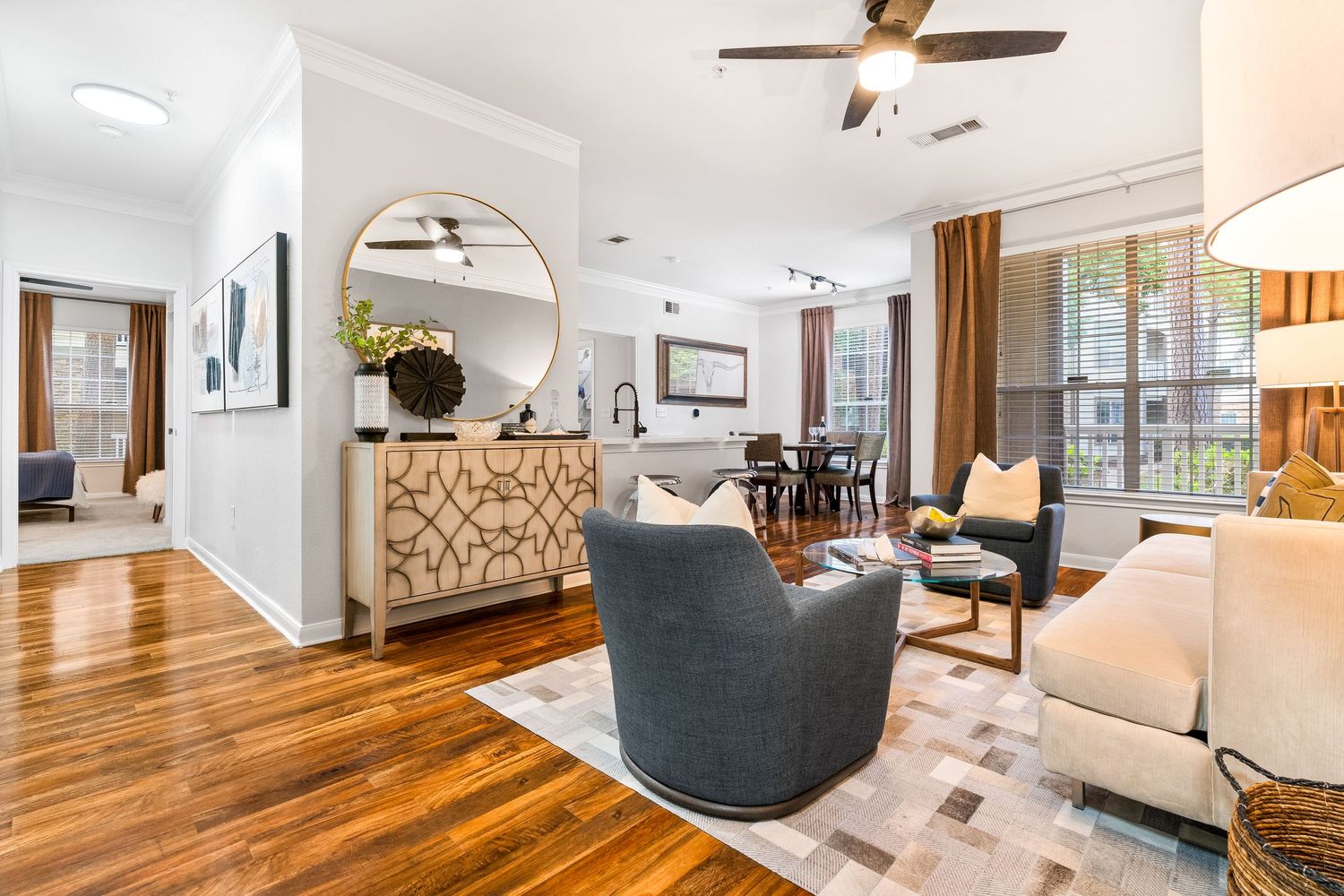Modern apartment interior with hardwood floors and contemporary furnishings.