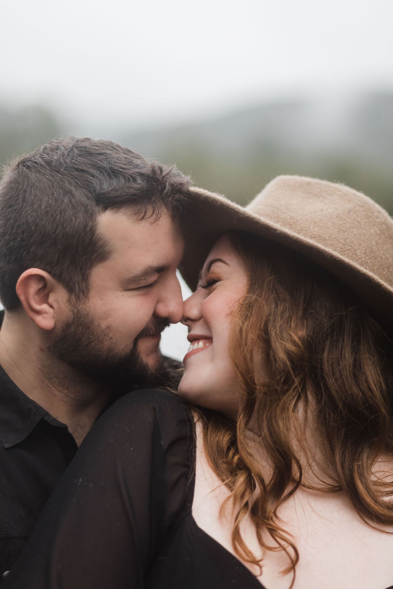 Close-up view of a couple sharing a tender moment while wearing casual attire.