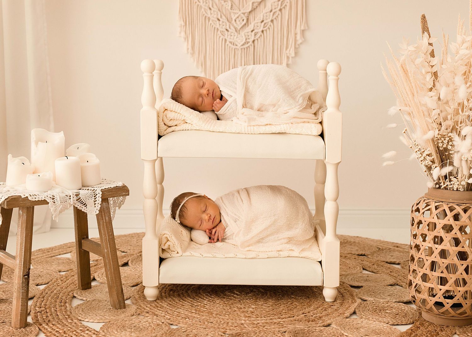 Bohemian styled nursery setting with macrame decor and white furniture.