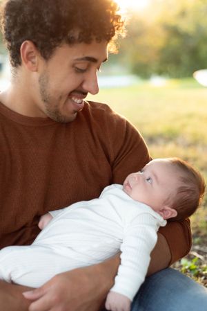 Father looking down at his baby
