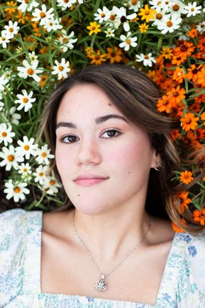 Senior Portrait with flowers behind