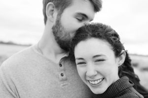 Engagement Session with man kissing fiance's head