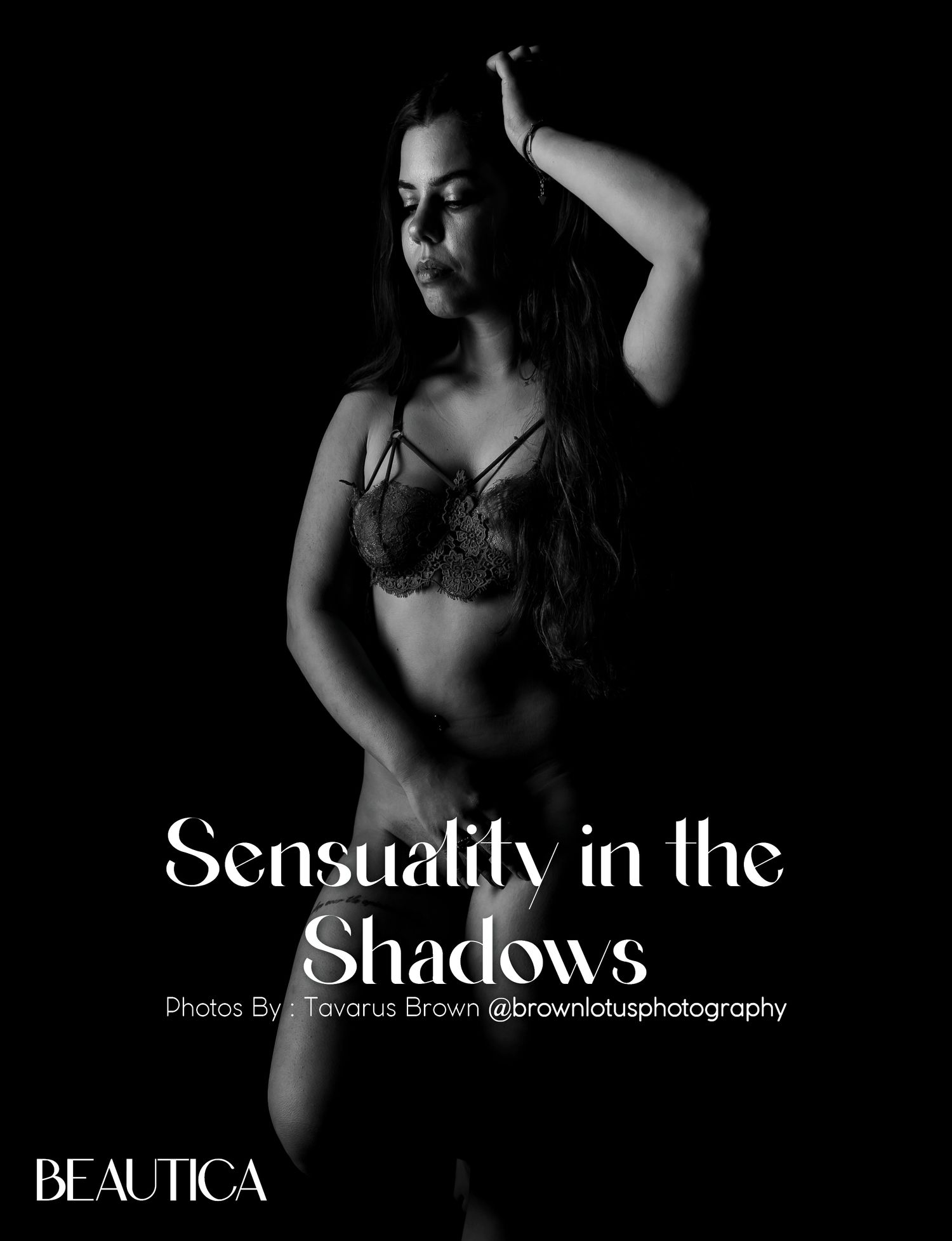 Artistic black and white boudoir portrait with dramatic shadows and lighting.