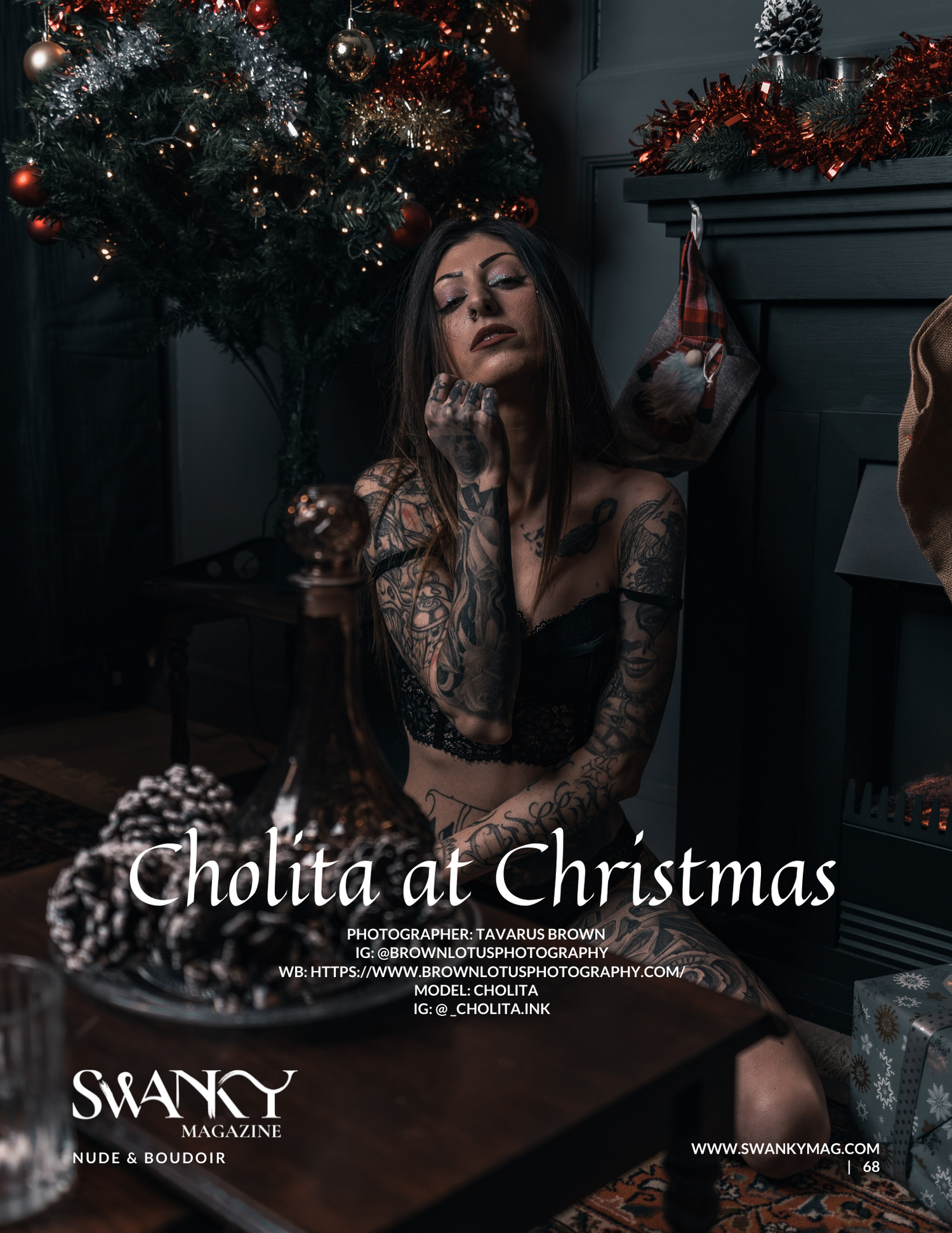 Moody dark Christmas scene with tattoos and decorations in black and red tones against holiday lights.