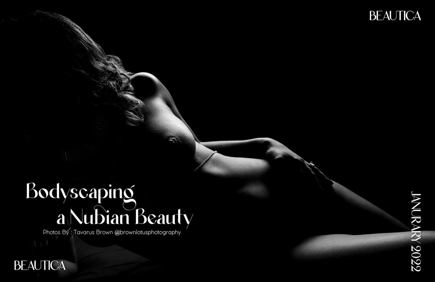 A dramatic black and white artistic nude silhouette showing the curves and contours of a reclined figure.