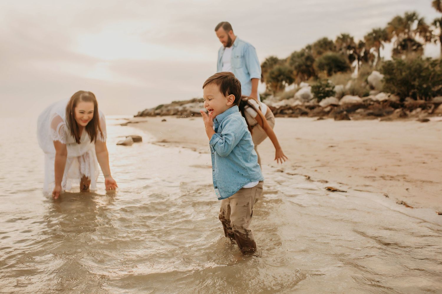 St Pete Beach Photographer- St Pete Beach family photographer- Family on beach playing in water