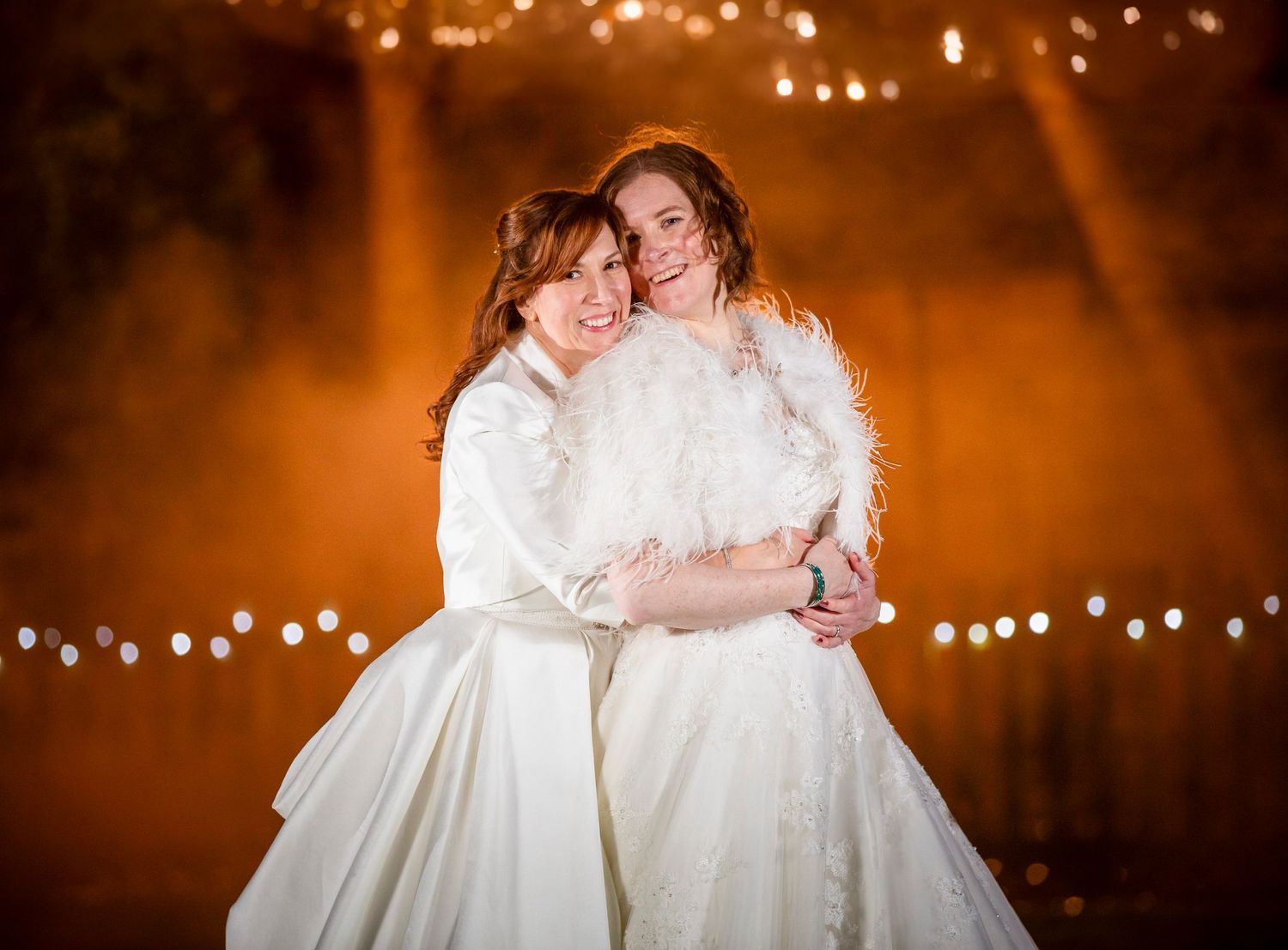 Evening outdoor wedding scene with twinkle lights creating a romantic ambiance.