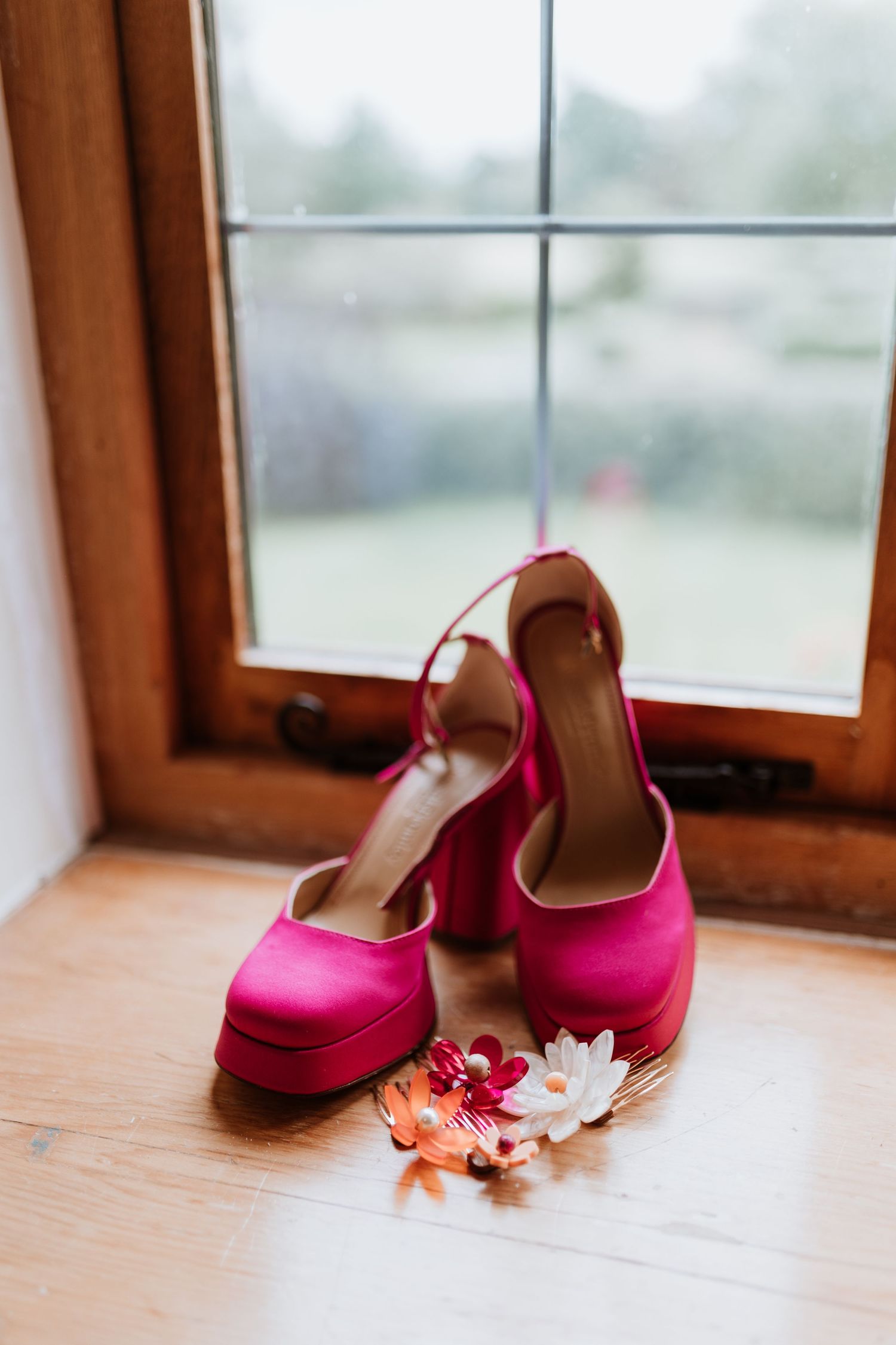 Bright pink wedding shoes with wolf and moon hair clips