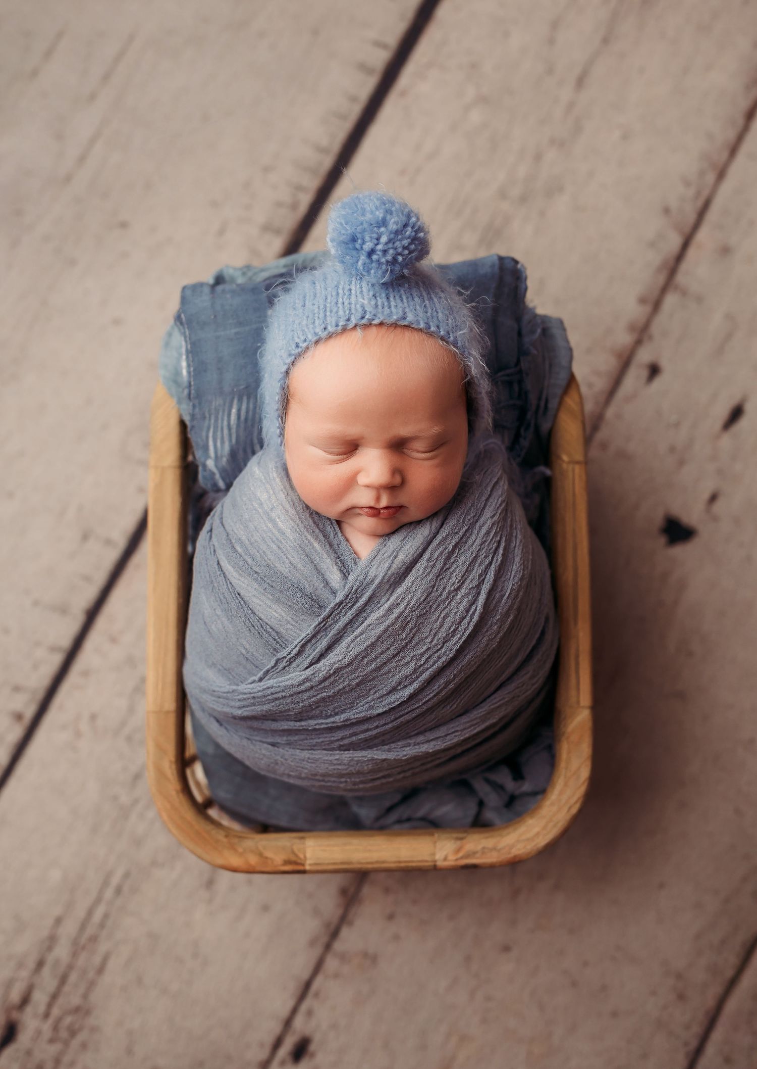 broken arrow ok newborn photos baby boy posed in crate