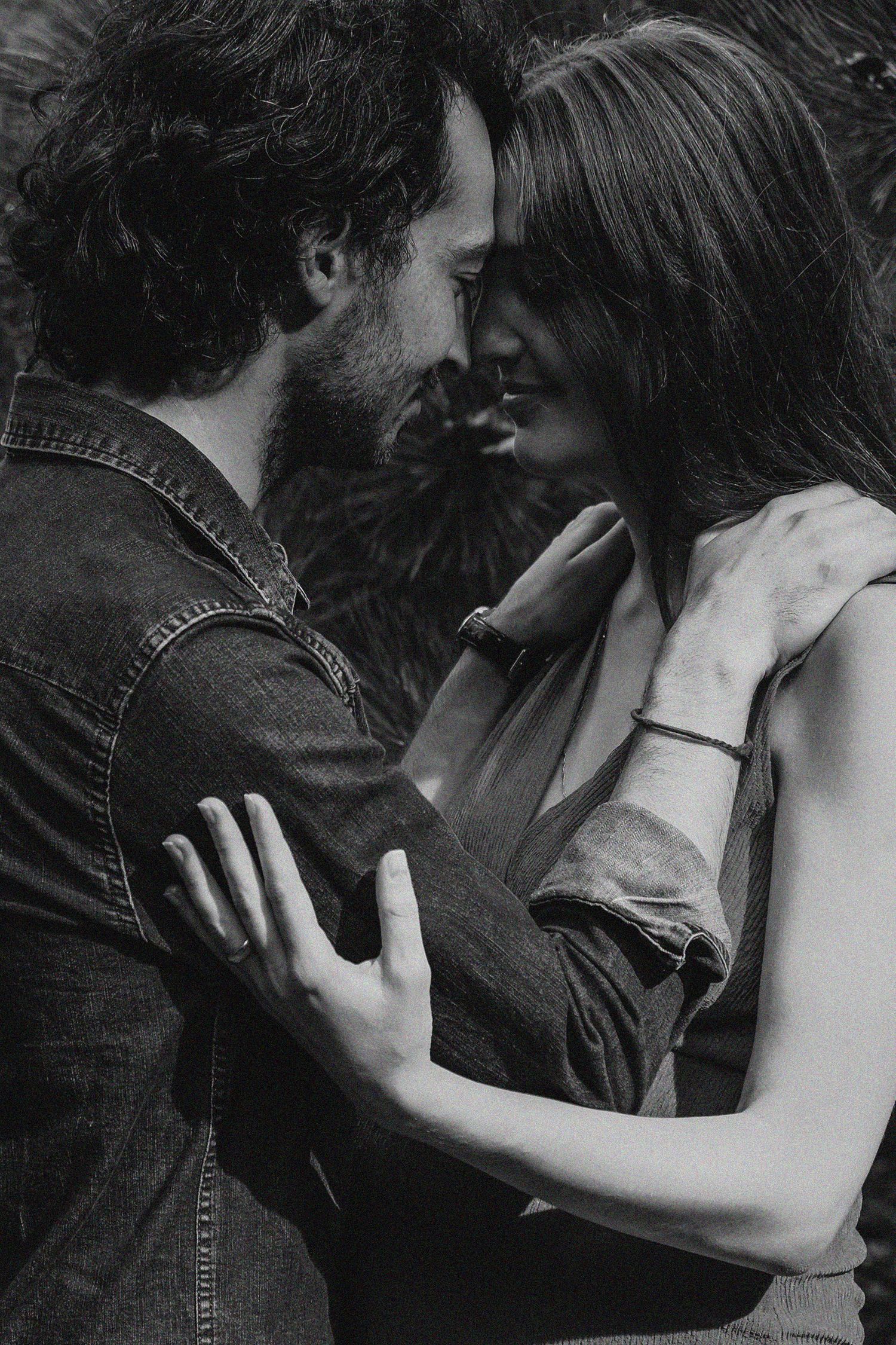 Artistic black and white intimate couple portraits showing tender moments.