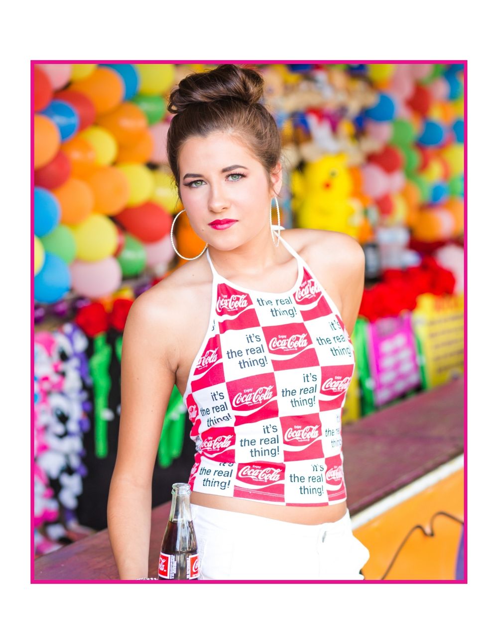 Colorful portrait with carnival backdrop featuring bright balloons and themed attire.