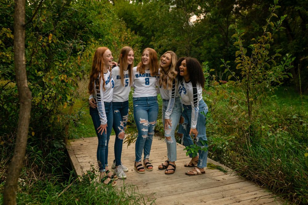 Group walking together on a nature path surrounded by greenery.
