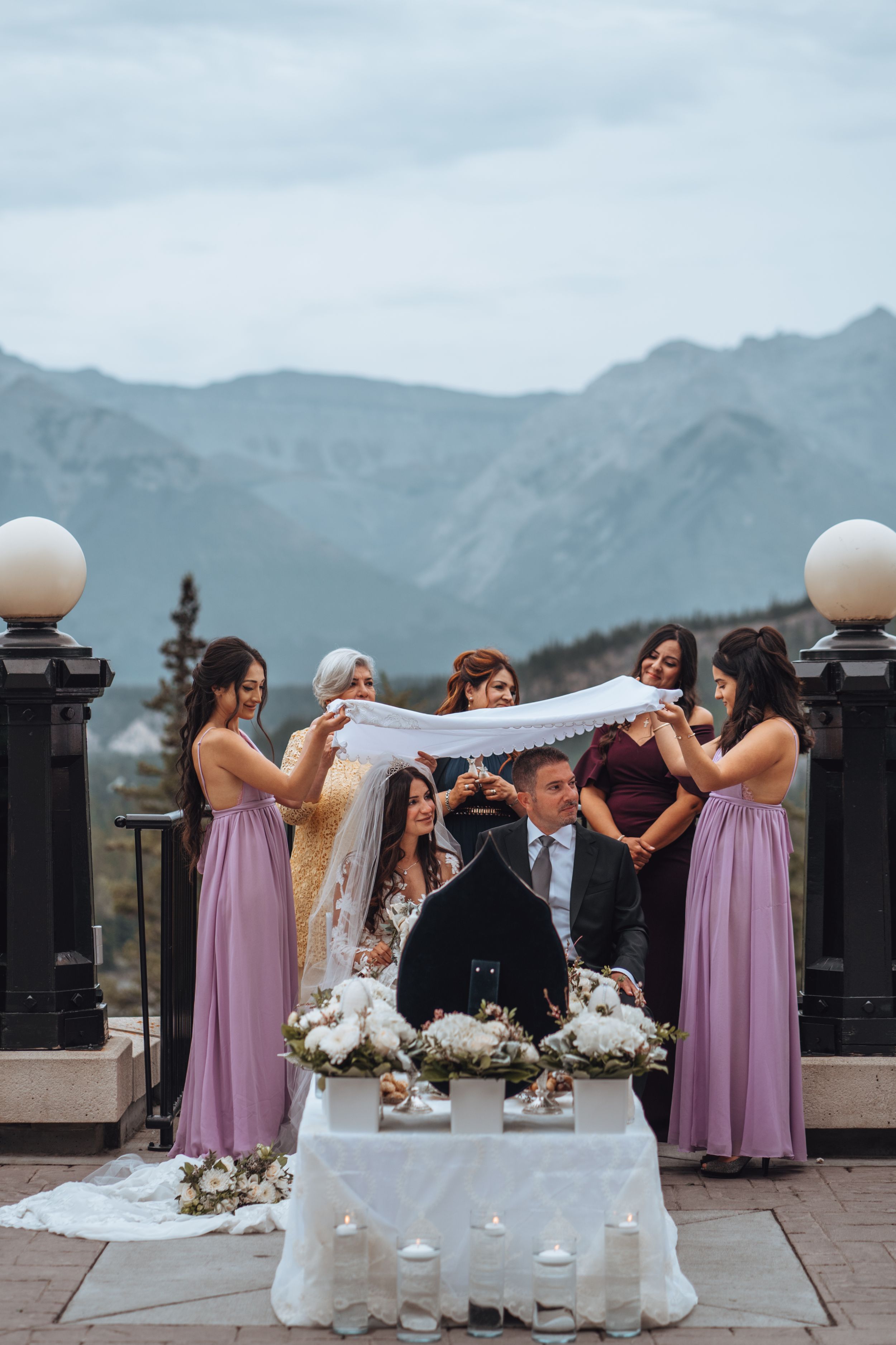 Bride & groom veiled during ceremony, mountain view. Rockies wedding ceremony tradition.