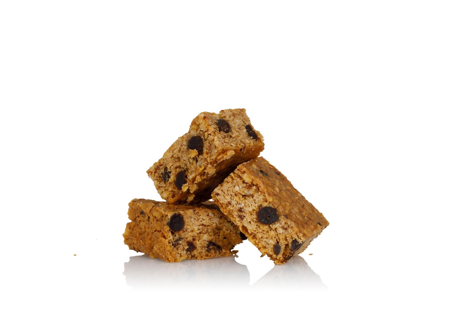 Stack of three protein bars with chocolate chips showing texture and layers from a product photoshoot.
