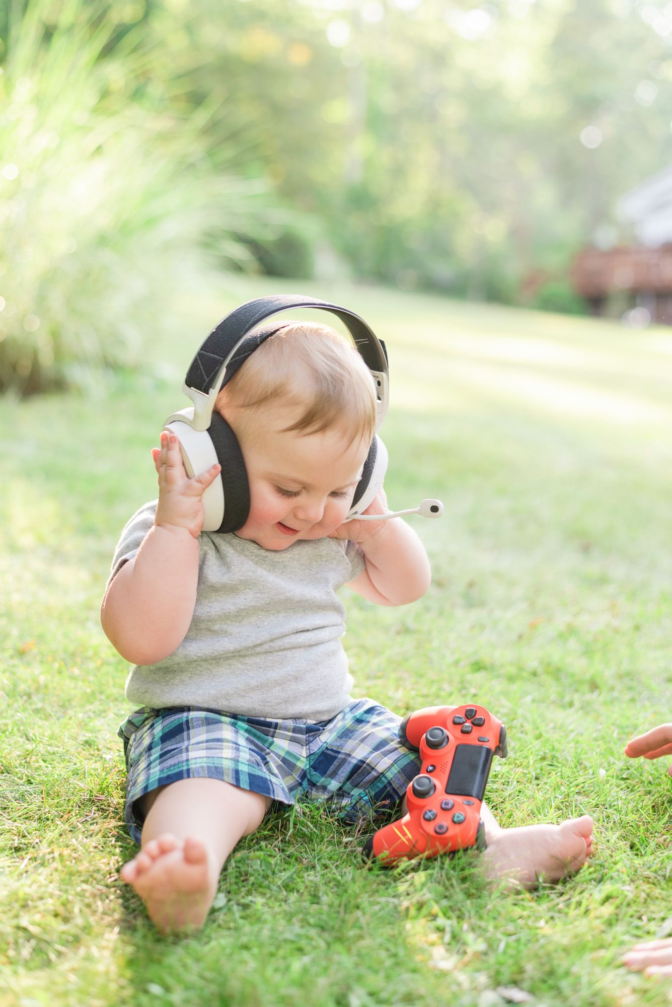 Baby wearing gaming headphones with controller in Mars, Pennsylvania